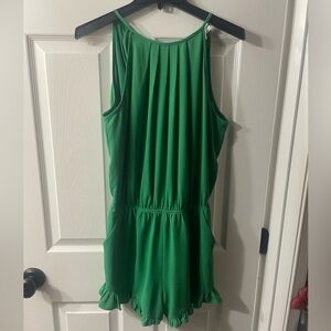 TCEC Money Green Pleated Romper With Open Back & Ruffled Shorts. Size M